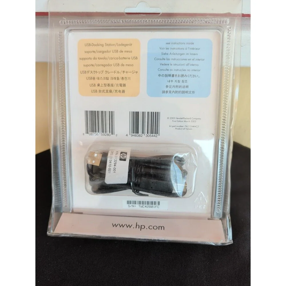 HP iPAQ Pocket PC h1900 series USB dock/charger.